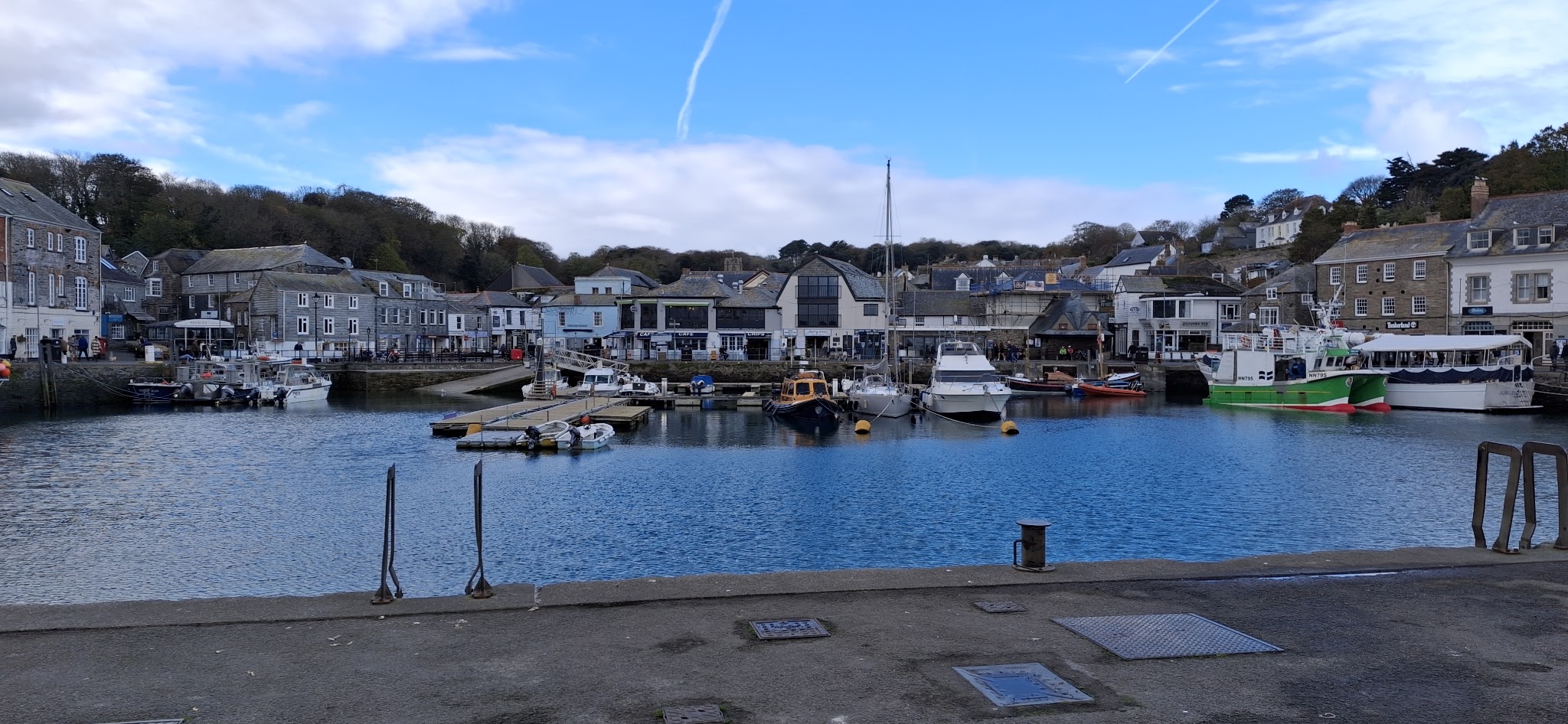 Padstow harbour with fishing boats, the town rising behind