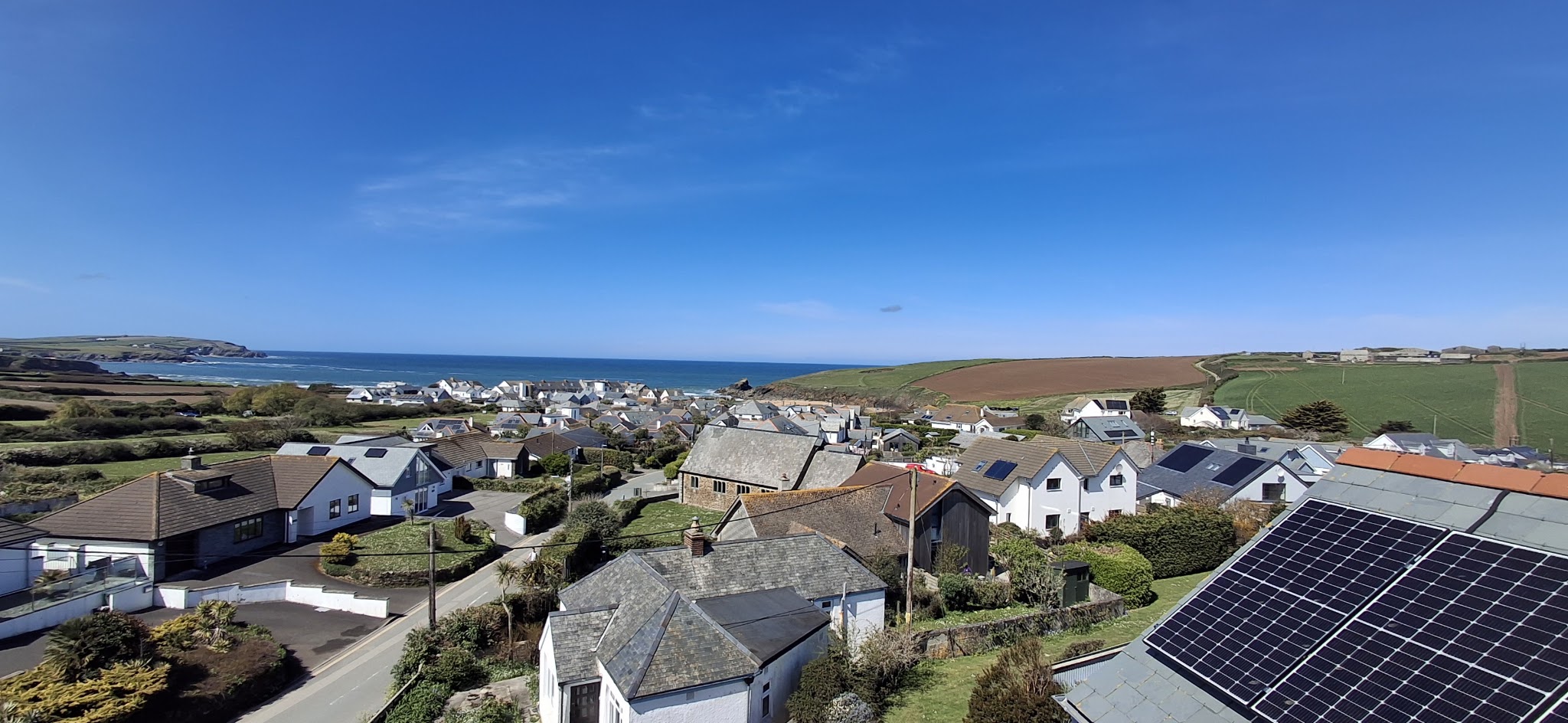 Rooftop view over a coastal Cornish village to the sea